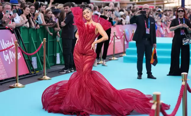 Sarah Engels from Germany walks on the Turquoise Carpet during the official start of the Eurovision Song Contest week at the town hall in Vienna, Austria, Sunday, May 10, 2026. (AP Photo/Martin Meissner)