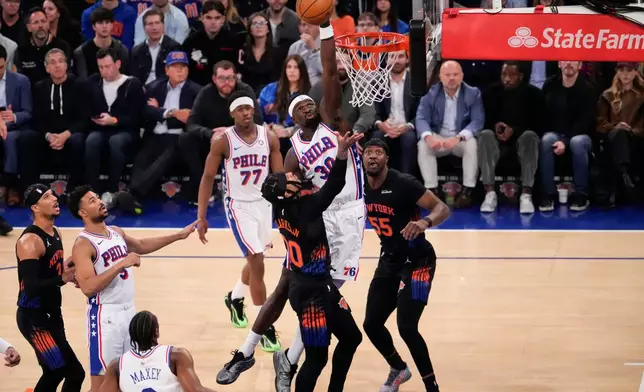 Philadelphia 76ers center Adem Bona (30) blocks New York Knicks guard Jordan Clarkson (00) during the first half of Game 2 in a second-round NBA basketball playoffs series, Wednesday, May 6, 2026, in New York. (AP Photo/Yuki Iwamura)