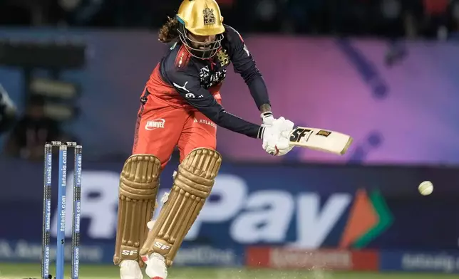Royal Challengers Bengaluru's captain Rajat Patidar plays a shot during the Indian Premier League cricket match between Gujarat Titans and Royal Challengers Bengaluru in Dharamshala, India, Tuesday, May 26, 2026. (AP Photo/Ashwini Bhatia)