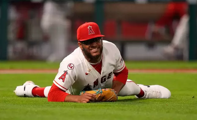 Los Angeles Angels pitcher Walbert Urena lays on the ground after being hit by a ball batted by New York Mets' Bo Bichette during the sixth inning of a baseball game Friday, May 1, 2026, in Anaheim, Calif. (AP Photo/Mark J. Terrill)
