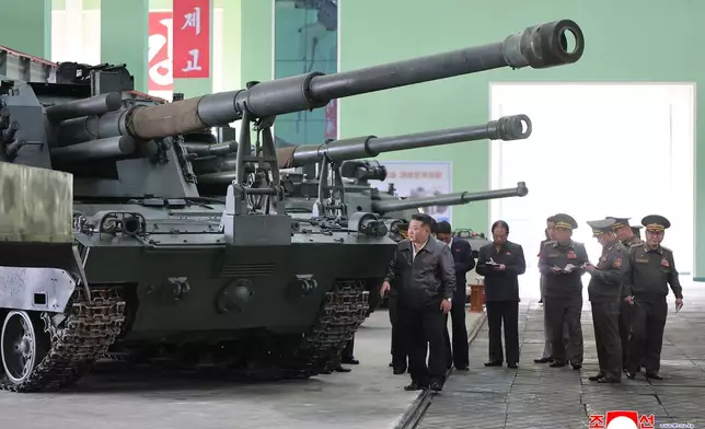 In this photo provided on May 8, 2026, by the North Korean government, its leader Kim Jong Un, center, visits a major munitions factory at an undisclosed location, North Korea Wednesday, May 6, 2026. Independent journalists were not given access to cover the event depicted in this image distributed by the North Korean government. The content of this image is as provided and cannot be independently verified. Korean language watermark on image as provided by source reads: "KCNA" which is the abbreviation for Korean Central News Agency. (Korean Central News Agency/Korea News Service via AP)