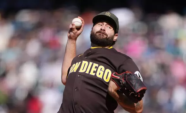 San Diego Padres starting pitcher Lucas Giolito throws against the Seattle Mariners during the first inning of a baseball game, Sunday, May 17, 2026, in Seattle. (AP Photo/Lindsey Wasson)