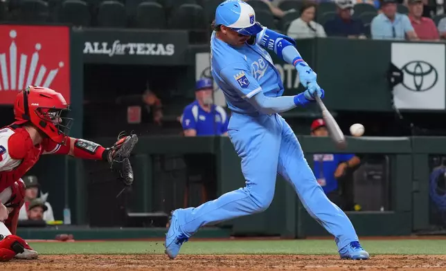 Kansas City Royals' Bobby Witt Jr. hits a single that scored teammate Nick Loftin during the seventh inning of a baseball game against the Texas Rangers, Saturday, May 30, 2026, in Arlington, Texas. (AP Photo/LM Otero)