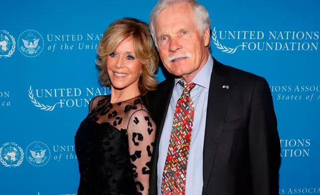 FILE - Actress Jane Fonda and CNN founder Ted Turner pose together at the United Nations Foundation Global Leadership Dinner, Nov. 6, 2013, in New York. (AP Photo/Jason DeCrow, File)