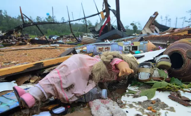 A doll and other items are seen amid the destruction at Gene’s Mobile Home Supply, a trailer park in Bogue Chitto, Miss., on Thursday, May 7, 2026, after a tornado cut across the state. (Matt WIlliamson/Enterprise-Journal via AP)