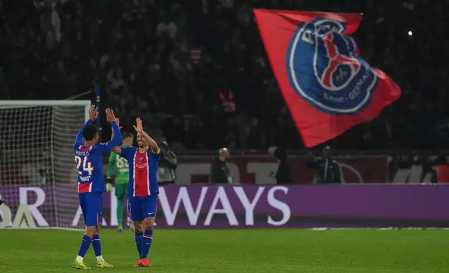 PSG's Senny Mayulu, left, and Marquinhos celebrate after the French League One soccer match between Paris Saint Germain and Brest in Paris, France, Sunday, May 10, 2026. (AP Photo/Thibault Camus)