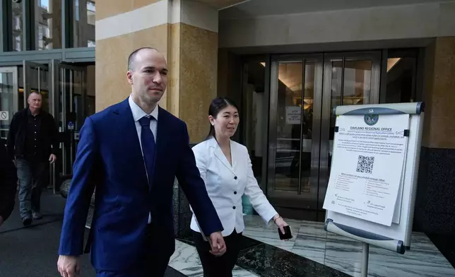 OpenAI president Greg Brockman, second left, exits the U.S. District Court, in Oakland, Calif., Thursday, April 30, 2026. (AP Photo/Godofredo A. Vásquez)