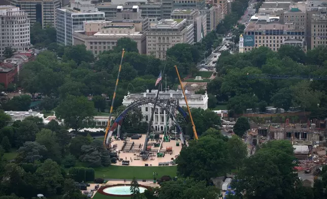 Equipment is seen being placed on the South Lawn of the White House, Tuesday, May 26, 2026, in Washington for a future UFC mixed martial arts fight to be held on June 14 as part of America 250 celebrations. (AP Photo/Mark Schiefelbein)