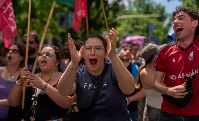 People take part during a protest in Madrid, Spain, Sunday, May 24, 2026, against rising housing costs that are pricing many Spaniards out of the market amid a broader housing crisis in Spain. (AP Photo/Manu Fernandez)