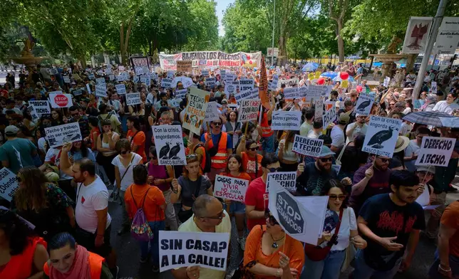 People take part during a protest in Madrid, Spain, on Sunday, May 24, 2026, against rising housing costs that are pricing many Spaniards out of the market amid a broader housing crisis in Spain. (AP Photo/Manu Fernandez)