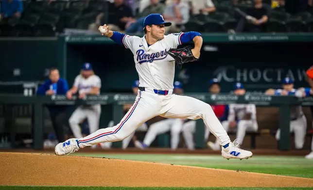 Texas Rangers' Jack Leiter pitches during the first inning of a baseball game against the Houston Astros, Tuesday, May 26, 2026, Arlington, Texas. (AP Photo/Jessica Tobias)