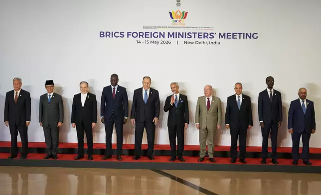 Foreign ministers and representatives of the BRICS nations, from right, UAE's Minister of State for International Cooperation Reem Al Hashimy, Ethiopia's Minister of Foreign Affairs Gedion Timothewos, Egypt's Foreign Minister Badr Abdelatty, Brazil's Foreign Minister Mauro Vieira, India's Foreign Minister S.Jaishankar, Russia's Foreign Minister Sergey Lavrov, South Africa's Minister of Foreign Affairs Ronald Lamola, Iranian Foreign Minister Abbas Araghchi, Indonesia's Foreign Minister Sugiono and Chinese Ambassador to India Xu Feihong pose for a group photo during a two-day meeting in New Delhi, India, Thursday, May 14, 2026. (AP Photo/Manish Swarup)