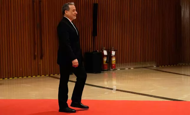 Iranian Foreign Minister Abbas Araghchi arrives for a two-day BRICS nations Foreign Ministers meeting in New Delhi, India, Thursday, May 14, 2026. (AP Photo/Manish Swarup)