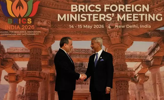 India's Foreign Minister S.Jaishankar, right, shakes hands with Iranian Foreign Minister Abbas Araghchi as he arrives for a two-day BRICS nations meeting in New Delhi, India, Thursday, May 14, 2026. (AP Photo/Manish Swarup)