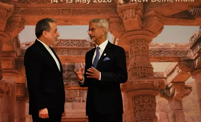 India's Foreign Minister S.Jaishankar, right, speaks with Iranian Foreign Minister Abbas Araghchi as he arrives for a two-day BRICS nations meeting in New Delhi, India, Thursday, May 14, 2026. (AP Photo/Manish Swarup)