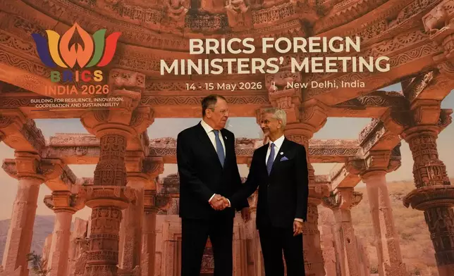 India's Foreign Minister S.Jaishankar, right, shakes hands with Russia's Foreign Minister Sergey Lavrov as he arrives for a two-day BRICS nations meeting in New Delhi, India, Thursday, May 14, 2026. (AP Photo/Manish Swarup)