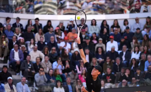 Jannik Sinner, of Italy, returns the ball to Casper Ruud, of Norway, during the final match at the Italian Open tennis tournament, in Rome, Sunday, May 17, 2026. (AP Photo/Andrew Medichini)