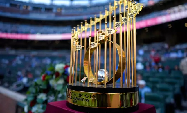 The 1995 World Championship trophy is seen during a tribute to former manager Bobby Cox before a baseball game between the Atlanta Braves and the Chicago Cubs, Tuesday, May 12, 2026, in Atlanta. (AP Photo/Mike Stewart)