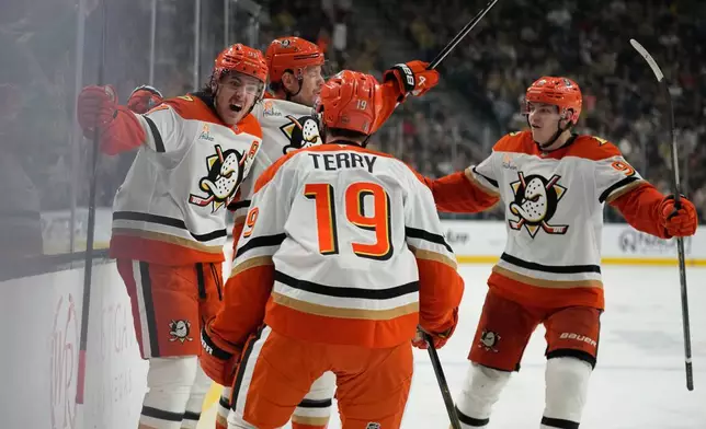 Anaheim Ducks center Leo Carlsson, left, celebrates after scoring against the Vegas Golden Knights during the third period of Game 2 of a second-round NHL hockey Stanley Cup playoff series Wednesday, May 6, 2026, in Las Vegas. (AP Photo/John Locher)