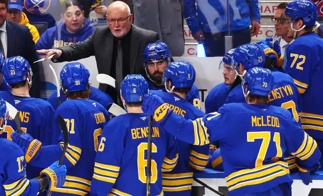 Buffalo Sabres head coach Lindy Ruff speaks with team during the third period in Game 1 of a second-round NHL hockey Stanley Cup playoff series against the Montreal Canadiens Wednesday, May 6, 2026, in Buffalo, N.Y. (AP Photo/Jeffrey T. Barnes)