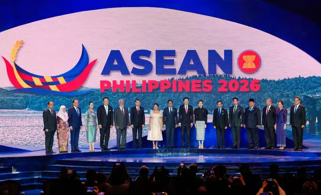 From left, Myanmar's Permanent Secretary of the Ministry of Foreign Affairs Hau Khan Sum, Malaysia's first lady Wan Azizah Wan Ismail, Malaysia's Prime Minister Anwar Ibrahim, Thailand's prime minister's wife Thananon Niramit, Thailand's Prime Minister Anutin Charnvirakul, East Timor's Prime Minister Xanana Gusmao, Vietnam's Prime Minister Le Minh Hung, Philippines first lady Maria Louise Marcos, Philippine President Ferdinand Marcos Jr., Singapore's Prime Minister Lawrence Wong, his wife Loo Tze Lui, Brunei's Sultan Hassanal Bolkiah, his son Prince Abdul Mateen, Indonesia's President Prabowo Subianto, Cambodia's Prime Minister Hun Manet, his wife Pich Chanmony and Laos' Prime Minister Sonexay Siphandone pose for a group photo during the opening ceremony of the 48th ASEAN Summit and Related Meetings in Cebu, Philippines on Friday, May 8, 2026. (AP Photo/Aaron Favila, Pool)