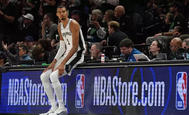 San Antonio Spurs forward Victor Wembanyama (1) waits to reenter the game during the first half of Game 3 of a NBA basketball second-round playoff series against the Minnesota Timberwolves in Minneapolis, Friday, May 8, 2026. (AP Photo/Abbie Parr)