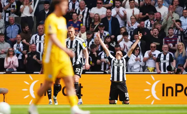 Newcastle United's William Osula celebrates scoring their side's first goal of the game during their English Premier League soccer match against Brighton &amp; Hove Albion in Newcastle, England, Saturday, May 2, 2026. (Owen Humphreys/PA via AP)