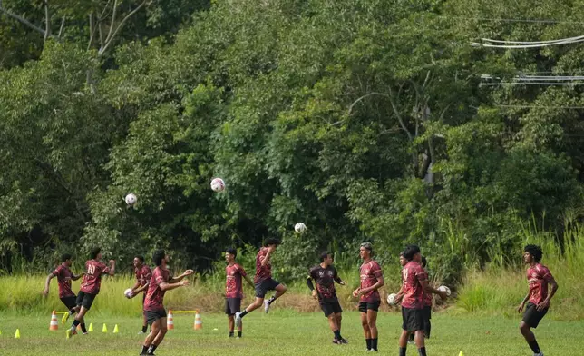 Members of Originarios, a new soccer team in Rio's fifth division made up exclusively of Indigenous players, train in Marica, Brazil, Tuesday, April 28, 2026. (AP Photo/Silvia Izquierdo)