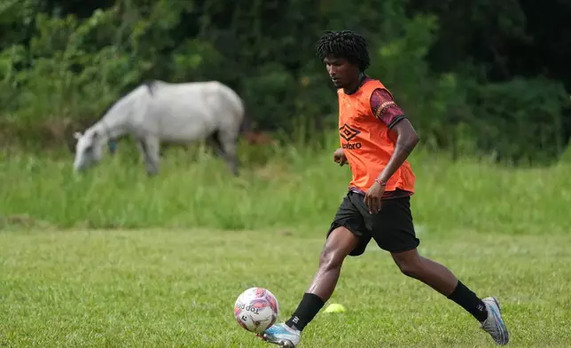 A player for Originarios, a new soccer club in Rio's fifth division made up exclusively of Indigenous players, controls the ball during a training session in Marica, Brazil, Tuesday, April 28, 2026. (AP Photo/Silvia Izquierdo)