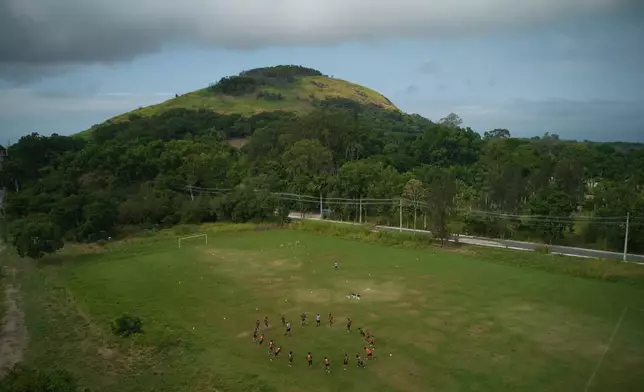 Members of Originarios, a new soccer team in Rio's fifth division made up exclusively of Indigenous players, train in Marica, Brazil, Tuesday, April 28, 2026. (AP Photo/Silvia Izquierdo)