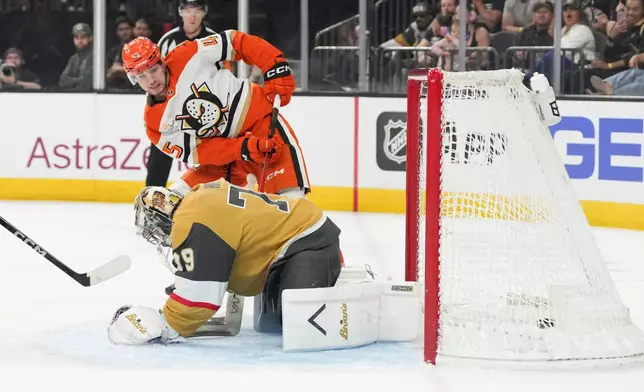 Anaheim Ducks right wing Beckett Sennecke (45) scores against Vegas Golden Knights goaltender Carter Hart (79) during the first period of Game 5 of a second-round NHL hockey Stanley Cup playoff series Tuesday, May 12, 2026, in Las Vegas. (AP Photo/Candice Ward)
