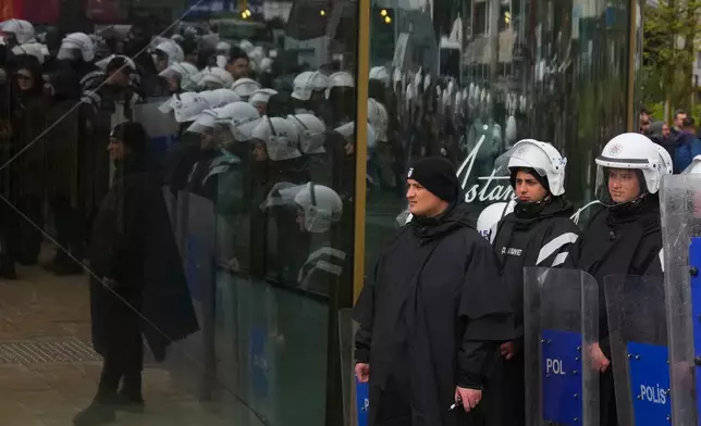 Turkish police officers stand guard as union members try to march towards Taksim square in Istanbul, Turkey, Friday, May 1, 2026, during Labor Day celebrations. (AP Photo/Khalil Hamra)