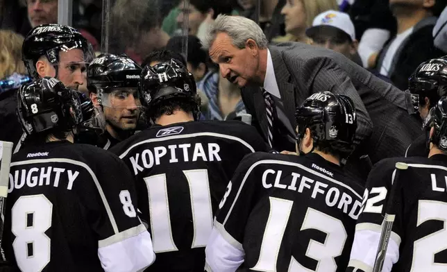 FILE - Los Angeles Kings head coach Darryl Sutter talks to his team during the third period of an NHL hockey game against the Columbus Blue Jackets, Jan. 7, 2012, in Los Angeles. (AP Photo/Mark J. Terrill, File)