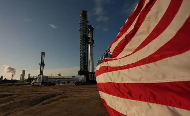 Trucks with nitrogen line up to help prepare SpaceX's mega rocket Starship for a test flight from Starbase, Texas, Friday, May 22, 2026. (AP Photo/Eric Gay)