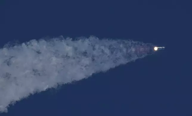 SpaceX's mega rocket Starship makes a test flight from Starbase, Texas, Friday, May 22, 2026. (AP Photo/Eric Gay)