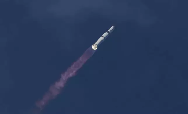 SpaceX's mega rocket Starship makes a test flight from Starbase, Texas, Friday, May 22, 2026. (AP Photo/Eric Gay)