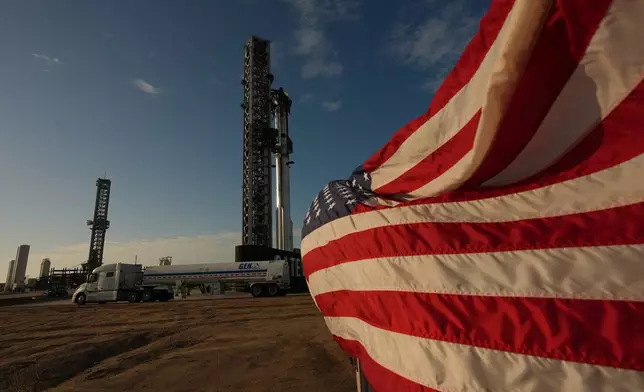 Trucks with nitrogen line up to help prepare SpaceX's mega rocket Starship for a test flight from Starbase, Texas, Friday, May 22, 2026. (AP Photo/Eric Gay)