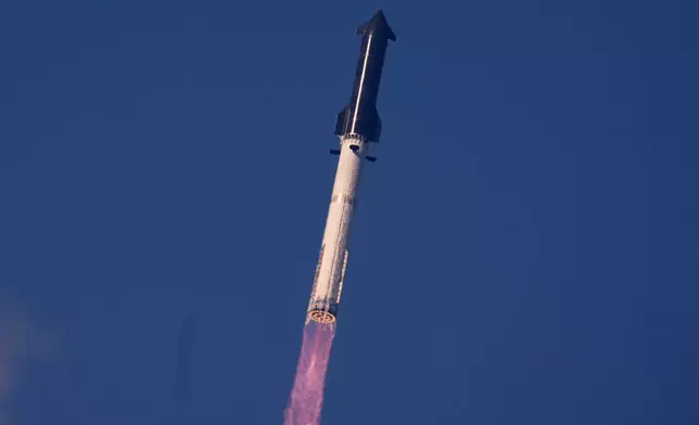 SpaceX's mega rocket Starship makes a test flight from Starbase, Texas, Friday, May 22, 2026. (AP Photo/Eric Gay)