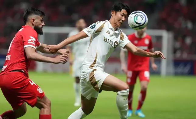 Son Heung-Min of the United States' Los Angeles FC, right, and Bruno Mendez of Mexico's Toluca vie for the ball during a CONCACAF Champions Cup second leg semifinal soccer match in Toluca, Mexico, Wednesday, May 6, 2026. (AP Photo/Fernando Llano)