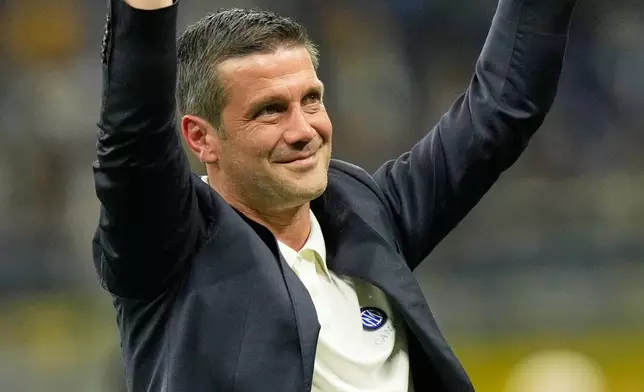 Inter Milan's head coach Cristian Chivu celebrates their victory at the Serie A soccer match between Inter Milan and Parma, in Milan, Italy, Sunday, May 3, 2026. (AP Photo/Luca Bruno)