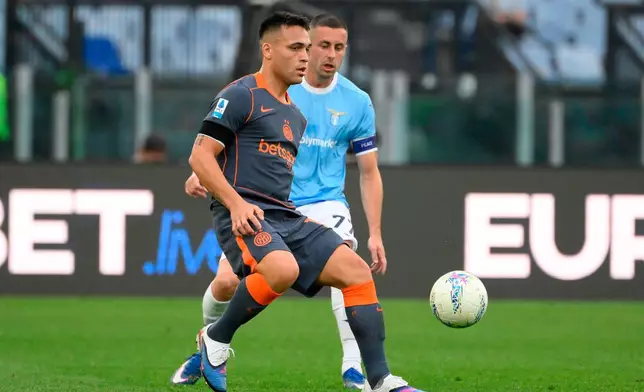 Inter Milan's Lautaro Martinez, left, controls the ball from Lazio's Adam Marušić during a Serie A soccer match, in Rome, Saturday, May 9, 2026. (Fabrizio Corradetti/LaPresse via AP)