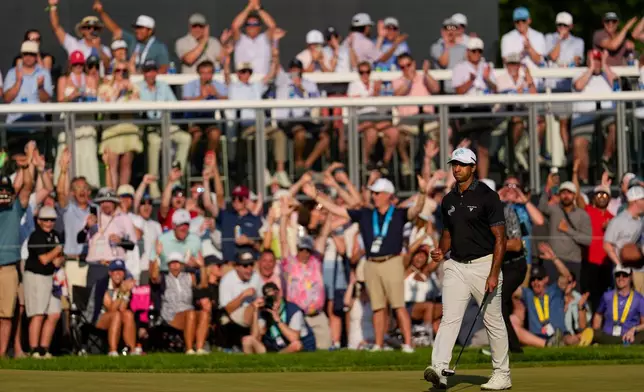 Aaron Rai, of England, celebrates after his shot on the 17th green during the final round of the PGA Championship golf tournament at Aronimink Golf Club, Sunday, May 17, 2026, in Newtown Square, PA. (AP Photo/Carolyn Kaster)