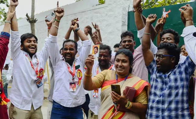 Tamilaga Vettri Kazhagam (TVK) workers hold photographs of their leader, actor-turned-politician Vijay Chandrasekhar, as they celebrate early leads and results in the recently held state election, in Chennai, southern Indian state of Tamil Nadu, Monday, May 4, 2026. (AP Photo)