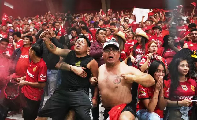 Toluca fans reacts during the penalty shootout on the CONCACAF Champions Cup final soccer match against Tigres in Toluca, Mexico, Saturday, May 30, 2026. (AP Photo/Fernando Llano)