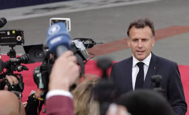 French President Emmanuel Macron speaks with the media as he arrives for a meeting of the European Political Community in Yerevan, Armenia, Monday, May 4, 2026. (AP Photo/Anthony Pizzoferrato)