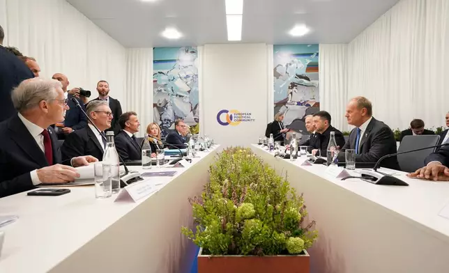 Ukraine's President Volodymyr Zelenskyy, second right, sits opposite Britain's Prime Minister Keir Starmer, second left, and France's President Emmanuel Macron, third left, during the Ukraine multi-lateral meeting, co-chaired by UK and France at the European Political Community summit in Yerevan, Armenia, Monday May 4, 2026. (Stefan Rousseau/Pool Photo via AP)