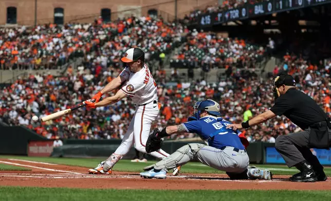 Baltimore Orioles' Gunnar Henderson ground into a force out and reaches first base off of Toronto Blue Jays pitcher Trey Yesavage during the first inning of a baseball game, Saturday, May 30, 2026, in Washington. (AP Photo/Terrance Williams)
