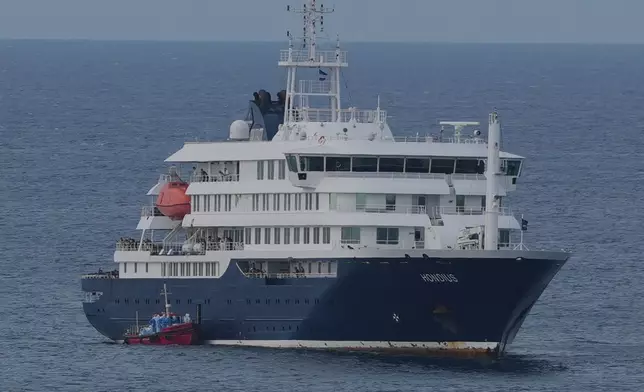 The MV Hondius cruise ship is anchored at a port in Praia, Cape Verde, Wednesday, May 6, 2026. (AP Photo/Misper Apawu)