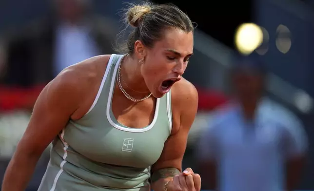 Aryna Sabalenka of Belarus celebrates a point during her match against Hailey Baptiste of the U.S. during the Madrid Open tennis tournament in Madrid, Tuesday, April 28, 2026. (AP Photo/Manu Fernandez)