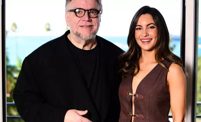 Director Guillermo del Toro, left, and Ivana Baquero pose for portrait photographs for the 20th anniversary of the film 'Pan Labyrinth' at the 79th international film festival, Cannes, southern France, Tuesday, May 12, 2026. (Photo by Scott A Garfitt/Invision/AP)